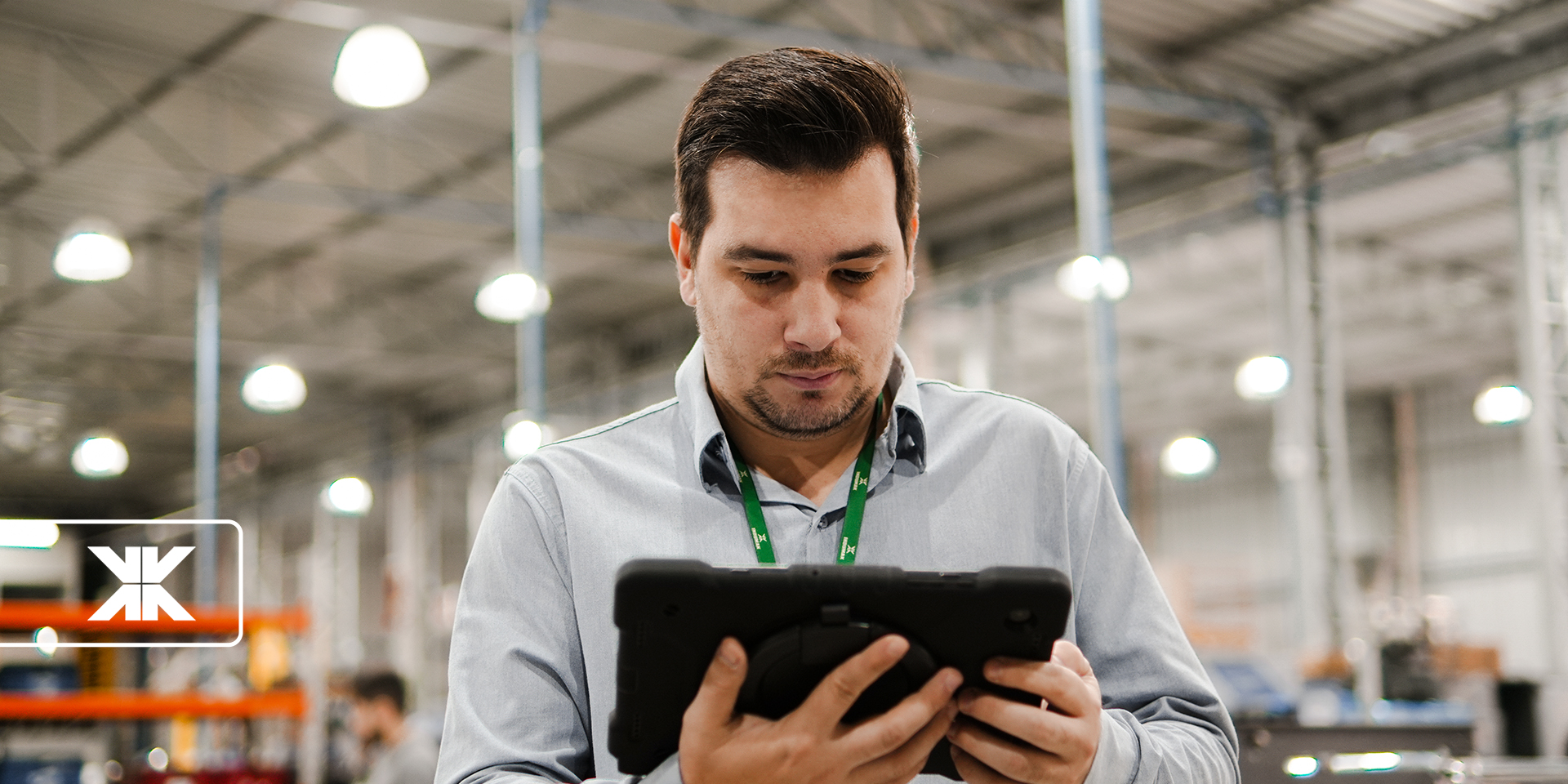 Indumak employee looking at a tablet